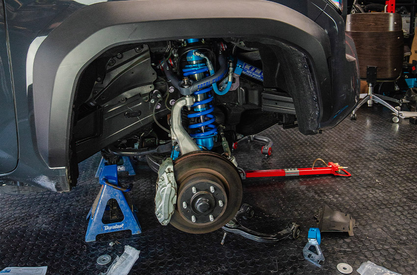 Suspensions being worked on, on a Toyota 4Runner